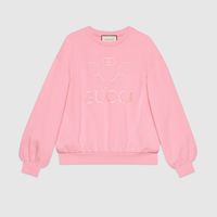 Shop the Oversize sweatshirt with Gucci Tennis by Gucci. Enhancing a light pink oversize sweatshirt, the Gucci Tennis embroidery is inspired by the House's archive pieces for a country club from 1987. With a retro feel that transcends seasons, the logo is created for an imaginary Gucci team or sports club. The preppy influence seen throughout the House narrative continues to evolve with a new sports-themed logo created for Pre-Fall 2019.