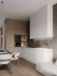 A sleek and modern kitchen featuring a mix of wood and white cabinetry, elegant lighting, and a cozy dining area.