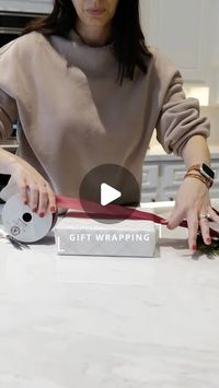 KARIN TENTORi on Instagram: "Gift Wrap How To 🎁 Beautiful ribbon is sure to dress up any gift! Here’s how to get the ribbon flat and the perfect length!

Start by measuring 6 box lengths (1 to 2 more if doing a full bow) of your ribbon. 

Hold one end on left side with a little slack, wrap around once, twist on the side and then wrap again the other direction. Finish by tucking under and tie either knot or bow. 

You can also add a fresh stem, rosemary, or bells for a festive look!

Comment SHOP below to receive a DM with the link to shop this post on my LTK ⬇ https://liketk.it/50zAz #ltkholiday #ltkgiftguide #giftwrap #giftwrapping #giftwrappingskills"