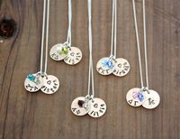 "This sorority necklace contains two *petite* 1/2\" sterling silver discs that have been textured, hand stamped & oxidize with the Greek letters of your choice. The second disc is stamped with big sis, lil sis, sisters, a name or initial. Your sorority's colors in Swarovski crystals accent your new necklace. Each set of pendants comes hung on a beautiful 18\" sterling silver chain (if you need a different size, just ask!) and beautifully packaged in an organza bag all set to give. Also inclu