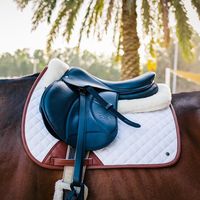 Available in jump, close contact, and dressage. Only at Equiluxe Tack: https://equiluxetack.com/products/sixteen-cypress-jumper-pad-white-cognac