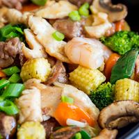 This Chinese Happy Family Stir-fry recipe is a combination of beef, chicken and shrimp, cooked in one pot with veggies and a light brown Chinese sauce.