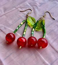 Handmade glass bead cherry dangle earrings. Available in Sterling silver and 18k gold plated hardware. Nickel free.