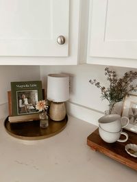 Neutral Kitchen decor🕯️🤎👩🏼‍🍳 kitchen decorating ideas, cookbook stand, kitchen countertops, Target home decor   Follow my shop @allyfilby on the @shop.LTK app to shop this post and get my exclusive app-only content!  #liketkit #LTKhome #LTKstyletip @shop.ltk https://liketk.it/4EaBI