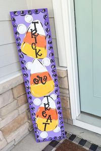 Looking for easy Halloween decorations and colorful Halloween porch decorating ideas? Join our porch leaner club and get painted porch decor for every season, like this colorful Halloween porch sign! Halloween porch decorating ideas have never been easier, join the porch leaner club and get seasonal porch decor delivered to you each season! Join now to receive these outdoor Halloween decorations and create a modern Halloween porch today!