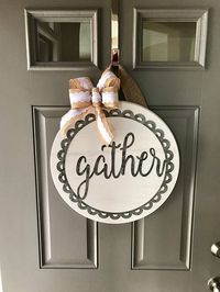 18” wood round door hanger - approx 1” thick. The burlap hanger is about 6” long. Wood round is white with round metal gather ***BOW may vary depending on ribbon availability. If an exact bow choice is preferred, please contact us before ordering Each door hanger is made to