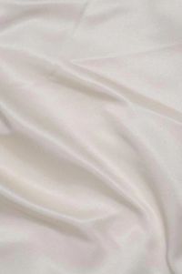 Ivory Silk Duchess Satin Fabric is a heavyweight, luxurious, soft, and shiny fabric with a beautiful pearly sheen and a matte back. Gracious and stylish fabric for special occasion garments that characterizes with crisp volume very easy to work with. The fabric is sold by the Yard, and measures 54 inches in width.