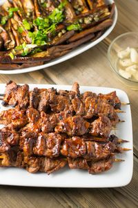 In this Filipino pork barbecue dish, the pork is sliced thinly, marinated overnight, skewered on bamboo sticks and cooked on a barbecue grill.