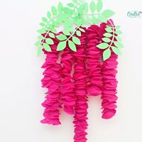 Need an easy idea for hanging paper flowers? A wisteria home decor is the perfect romantic touch! And this artificial wisteria wall hanging looks fabulous, is inexpensive and so easy to make!  #easypeasycreativeideas #crafts #papercrafts #paperflowers #DIYflowers #flowerhomedecor #homedecor #decorideas