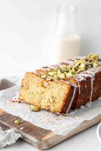 An easy dairy-free pistachio and lemon loaf cake with the addition of cardamon spice and finished off with a tangy lemon drizzle.