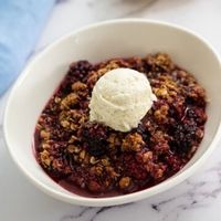 Blackberry Crisp is the ultimate dessert recipe. From the buttery, crispy oat topping to the juicy, plump sweet berries, this Blackberry Crisp recipe is easy to make and downright divine. It is the perfect summertime dessert to make with fresh berries but can be enjoyed year-round with frozen berries.