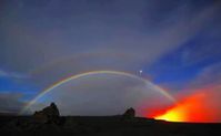 volcano goddess Pelé became active and unexpectedly showed us her fire and then she put another on top!! A beautiful glowing double rainbow manifests itself - the rainbow bridge that the ceremony was about !!!! The intention of the ceremony is for the rainbow snake to become the rainbow bridge!" The portal into the light age is open. In the background you can see the Jupiter Saturn conjunction! - an epic photo my friend Peter Leitch