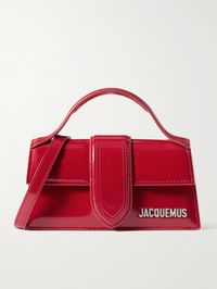 Jacquemus is  the  arbiter of micro bags - the smaller, the chicer. Nodding to Y2K with a hint of the '50s, this 'Le Bambino' tote is made from leather in a slim, rigid silhouette with a ladylike top handle. It'll hold a smartphone, keys and a cardholder.