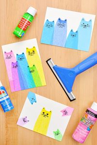 Cat squeegee painting is SO MUCH FUN! These cat scrape paintings are super easy to make and such a great painting craft for kids of all ages. Add a line of acrylic paint onto a piece of paper and use a squeegee to transform it into an adorable cat! All you need is paper, paint, and something to scrape the paint with!