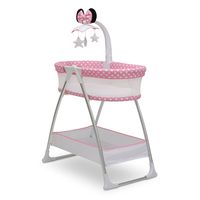 Big Minnie ears and pretty polka dot accents make this Minnie Mouse Bassinet by Delta Children feel so very special. The rotating mobile arm features spinning stars, as well as vibration, nightlight and soothing sounds to lull your newborn to sleep. For your convenience, the breathable mesh sides provide open airflow and clear view of your baby, and the easy-to-reach storage basket keeps changing essentials within reach. The Minnie Mouse by Delta Children is the easiest way to stay safely connec