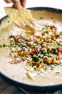 Elote Queso! A grill   app favorite all bubbled up in one skillet. Creamy melty queso, charred roasted corn, fresh jalapeño and garlic, and some cilantro and chili powder. YUM. #elote #queso #appetizer | pinchofyum.com