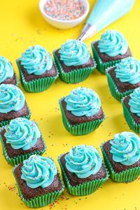 Square cupcakes are an elegant change to the normal round shape of cupcakes. Learn how to make square cupcakes with a square cupcake pan and other cupcake supplies including our sprinkles and greaseproof cupcake liners of course. #squarecupcakes #cupcakerecipe #cupcaketutorial