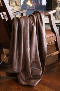 With a supple, faux leather front and a faux shearling back for ultra softness and warmth, the Crocodile Faux Leather Throw completes your rustic home. 100% polyester printed suede front with shearling back 54"W x 68"L Machine wash cold, gentle cycle, no bleach; tumble dry low