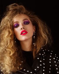 Tanya Kizko shows off bold makeup looks for the Winter 2018 issue of Flaunt Magazine. Captured by Matthew Priestley, the blonde beauty channels 1980's vibes complete with jewel toned eyeshadow and equally vibrant lip color