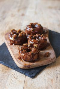 Baked Banana Bread Donuts topped with Maple Caramelised Pecans. Gluten, dairy, egg and cane sugar free! Vegan