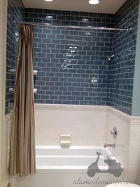 www.carolinawholesalefloors.com has more flooring and design ideas OR check out our Facebook! shower tile Bathroom, different styles split by a chair rail