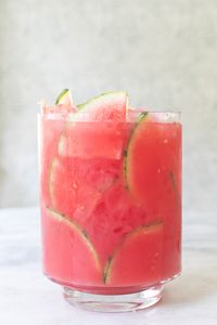 This watermelon cocktail punch is perfect for a summer cookout or 4th July celebrations! Made with simple ingredients and tequila, it’s sure to cool you down! #watermelonpunchnonalcoholicsummerdrinks #4thofjulydrinksnonalcoholicpartideas