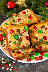 These Christmas cookie bars have a chewy brown sugar cookie base that’s loaded with plenty of holiday M&M candies and sprinkles.