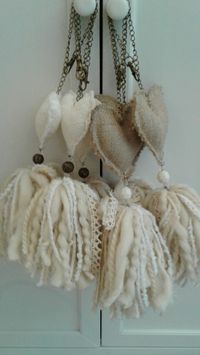 Decor tassels for wall or doors, in white and burlap color, with a stuffed heart on the top. #decortassel#, #handmadetassel#, #tassel#, #tasselwalldecor#, #tasselwallhanging#. #tasselhanging#