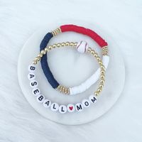 Listing is for one (1) bracelet containing 4mm 18k gold, silver or rose gold plated hematite beads, white/black letter beads and accented with a baseball bead. other bracelets pictured are just examples - all bracelets sold separately! red white & blue disc bracelets: https://shopsarahndipity.etsy.com/listing/1034035133 This bracelet stretches to fit small to medium sized wrists (approximately 7 inches long). Size customization available free of charge - leave your desired dimensions in the comm