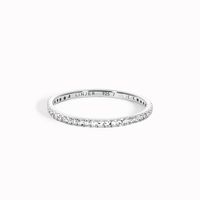 Our classic eternity ring dusted with 1.2mm white topaz stones on a silver band. This ring is also available in 14k gold and diamond.