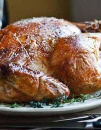 Barefoot Contessa recipe: Roast Turkey with Truffle Butter. Includes a whole head of garlic, along with onion and thyme...yuuuummm.