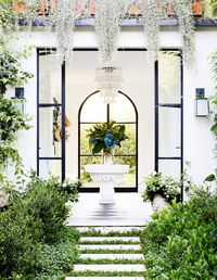 stunning foyer entryway with large iron doors | sydney home tour on coco kelley