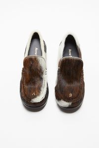 Leather loafers feature a unique multi-toned hairy finish, detailed with an embroidered animation on the front and leather soles. FN-WN-SHOE000845