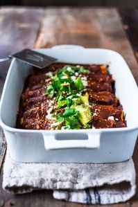 Roasted Butternut Enchiladas with Quick Mole Sauce - topped with cilantro, avocado and toasted sesame and pumpkin seeds. An easy delicious vegetarian main. | #mole #molesauce #enchiladas #vegetarian #butternut #butternutenchiladas #fall recipes www.feastingathome.com