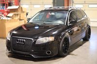 This 2006 Audi A4 Avant is modified with a custom AccuAir air suspension system as well as 19" MRR Design wheels, a later-model steering wheel, and a modified front bumper cover and exhaust system. The car is finished in Brilliant Black over Ebony leather and is powered by a turbocharged 2.0-liter inline-four linked with a six-speed manual transaxle, a Torsen torque-sensing center differential, and a Quattro all-wheel-drive system. Equipment includes the Sunroof Package, heated power-adjustab...