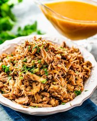 These Crockpot Pork Carnitas are full of incredible flavor and so easy to make. They are super versatile and perfect for tacos or burritos! #carnitas #porkcarnitas #crockpotcarnitas #recipe