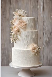 White tiered textured wedding cake 🍰     #wedding #weddingcake #texturedweddingcake #weddinginspo