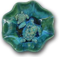 My collections of hand-sculptured Bowls, Platters, and Plaques are designed on the island of Maui Hawaii. The relief designs feature on my ceramics is Hawaiian-themes such as turtles, humpback whales, pineapples, fishes, and modern abstract colors. You can place these ceramics indoors or outdoors regardless of the climate. The glazes are non-toxic so you can serve hot or cold foods, delicious appetizers and will create a lovely presentation. Wire hook attached on the back. 3” x 16.5” $295.00