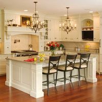 I love the island in this kitchen almost doubling as a table.