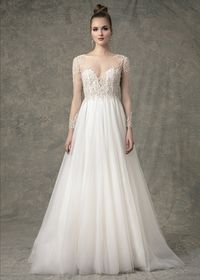 The Baylee wedding dress has a natural waist sparkle tulle A-line skirt with long sleeve illusion sweetheart lining. There is ivory beading through bodice and sleeves with buttons down center back. #wedding #weddingdress #longsleeveweddingdress #longsleevedweddingdress #weddingideas #weddingplanning #weddingdressstyles #bridalgown #ballgown #weddingdresses