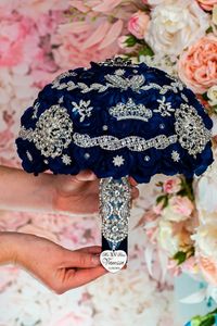 Embrace sophistication with our handcrafted Navy Blue and Silver Quinceañera Bouquet. Perfectly blending navy blue and shimmering silver accents, this 9-inch bouquet adds a touch of glamour to your quinceañera celebration. quinceañera bouquet navy blue silver,  quinceañera flowers, silver wedding bouquet, navy blue bridal bouquet, elegant quinceañera bouquet, floral arrangement for quinceañera, silver quinceañera decor, navy blue quinceañera accessories, quinceañera flower bouquet