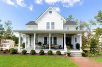 This farmhouse may look modest from outside, but there's nothing shy about its grand interior.