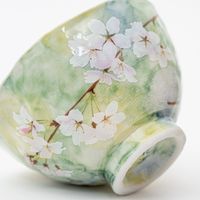 This pair of Bowls showcases delicate hand-painted cherry blossoms in soft, pastel colors, complete with falling petals. Crafted on a potter's wheel, the Bowls have a comfortable, warm feel when held. Description Size: DIA. 4.3",H 2.6" Capacity: 300ml / 10oz Material / component: Ceramic Origin: Japan Care: Dishwasher /Yes, Microwave Oven/ Yes Note: Please note as each piece is hand-made, slight variation in shape and glazing may occur.