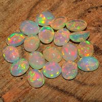 "Loose Opal-Natural Ethiopian Opal-10x12 mm Opal-Fire Opal-Opal Gemstone-Multi Opal Loose Gemstone-Play Of Color Opal-October Birthstone This listing is for the following 1 (ONE) Ring: ✦Gemstone: Natural Ethiopian Opal ✦Size: 10x12 mm ✦Gemstone Shape: Oval *Each item is packaged individually in a GIFT BOX Please view my full collection of ✦Jewelry✦: https://www.etsy.com/in-en/shop/JewelryhubStudio?ref=seller-platform-mcnav E X P E D I T E D ∙ S H I P P I N G You will be able to choose faster shi