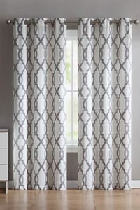 Give your windows a pop of pattern with the Caldwell Trellis Grommet Curtain Panel Pair, which features a two-toned quatrefoil trellis print on microfiber fabric. Available in two sizes and a variety of colors, this two-piece window curtain set features metal grommets at the top for easy hanging, opening, and closing. 2-piece window curtain panel set. Color: charcoal. Features quatrefoil trellis print with metal grommets. Available in a variety of colors. Made of 100% microfiber. Dry clean only.