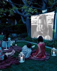 Throw your own film festival under the stars by projecting a movie in your backyard. Candlelit lanterns, fl...