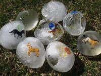 ice eggs - Freeze balloons filled with water and small toys. Cut balloon off and play with eggs outside. Provide spoons for cracking ice and digging treasures out. SUMMER