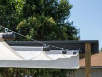 Control the shade by making your own DIY retractable canopy. Open it up to create a shady retreat or close it to let the sun in.