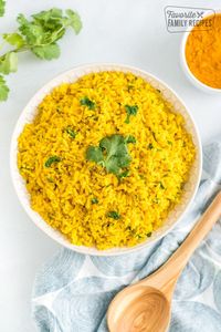 Super Easy Yellow Rice complements just about any meal! You can make this on the stove top or in the rice cooker. So tasty! #easyyellowricerecipe #yellowrice #rice #easyricerecipe #yellowricerecipe #ricerecipe #sidedish #ricesidedish