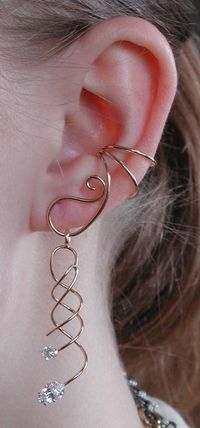 This is our amazing Ear Saver Ear Cuff with a beautiful spiral dangling with Marque Stone from the cuff. This cuff is non pierced and hugs the side of your ear comfortably and securely. The Ear Saver is versatile, you can remove this dangle and add any light weight earring part to hang off of the Ear Saver. If you desire only the Ear Saver Ear Cuff, it is available in a separate listing. This piece will arrive in a Gift Box and include simple fitting instructions. Perfect for gift giving